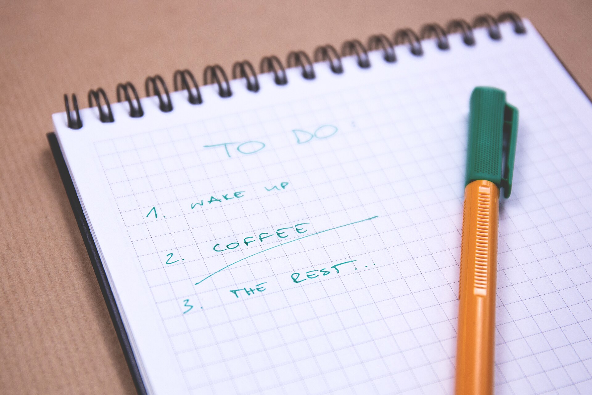 Spiral notebook with a short handwritten to-do list
